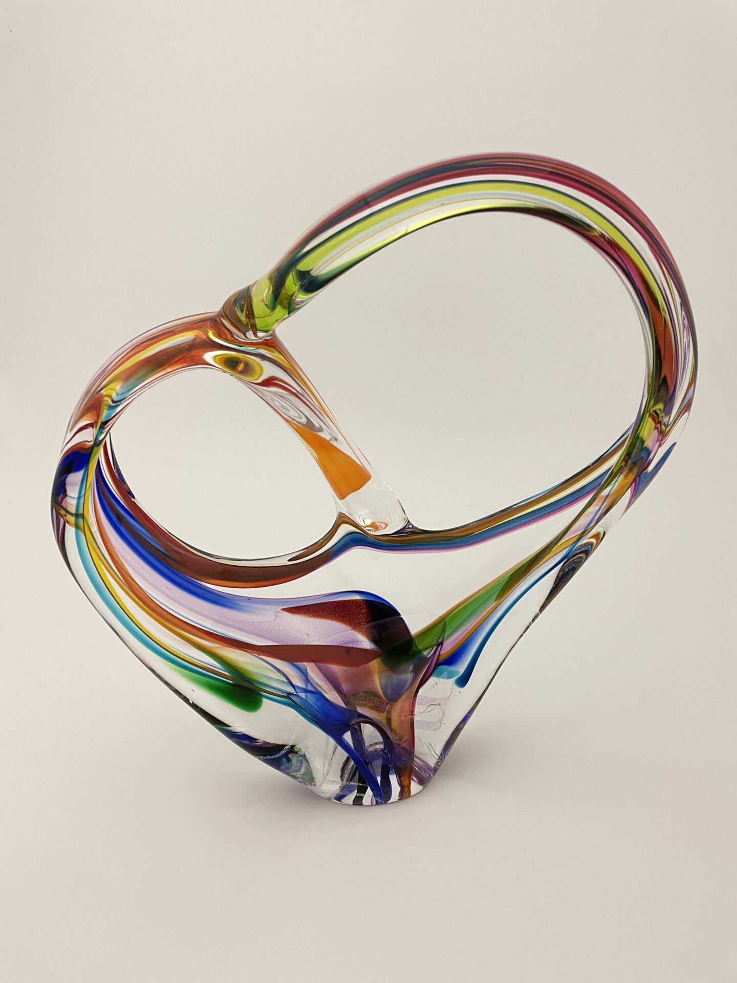 Thie pretzel glass sculpture by David Goldhagen is done in multiple colors.